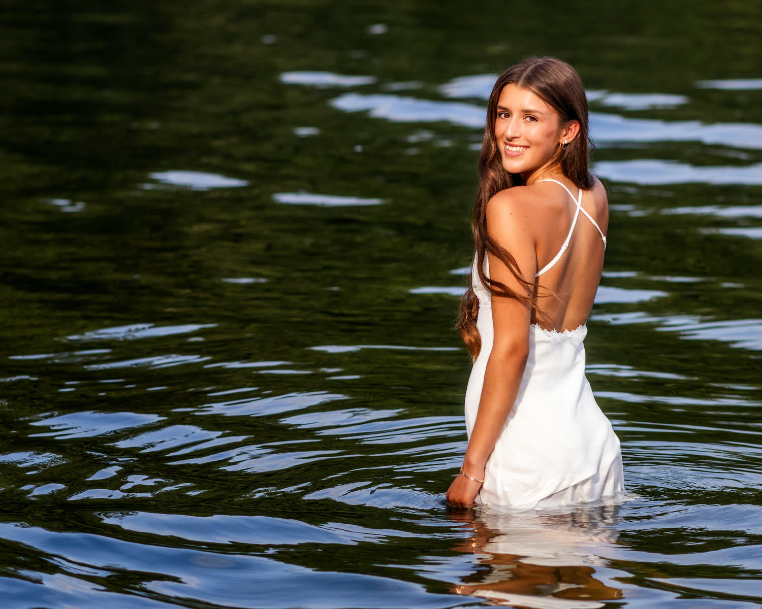 Senior portrait with white dress by the water